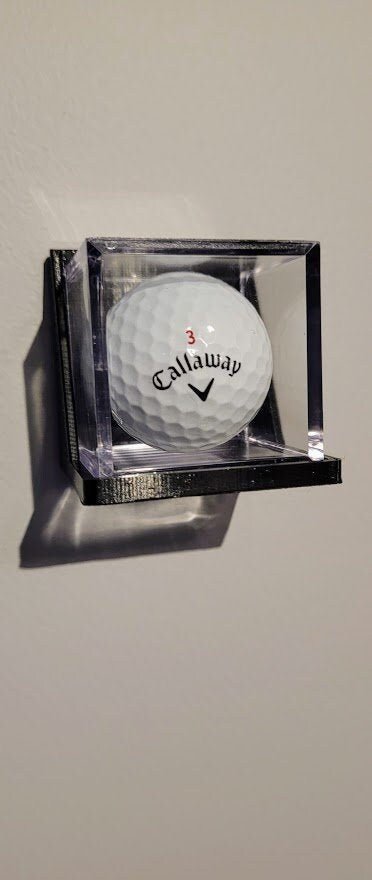 Wall Display Holder for Golf Balls and Golf Balls in UV Cases